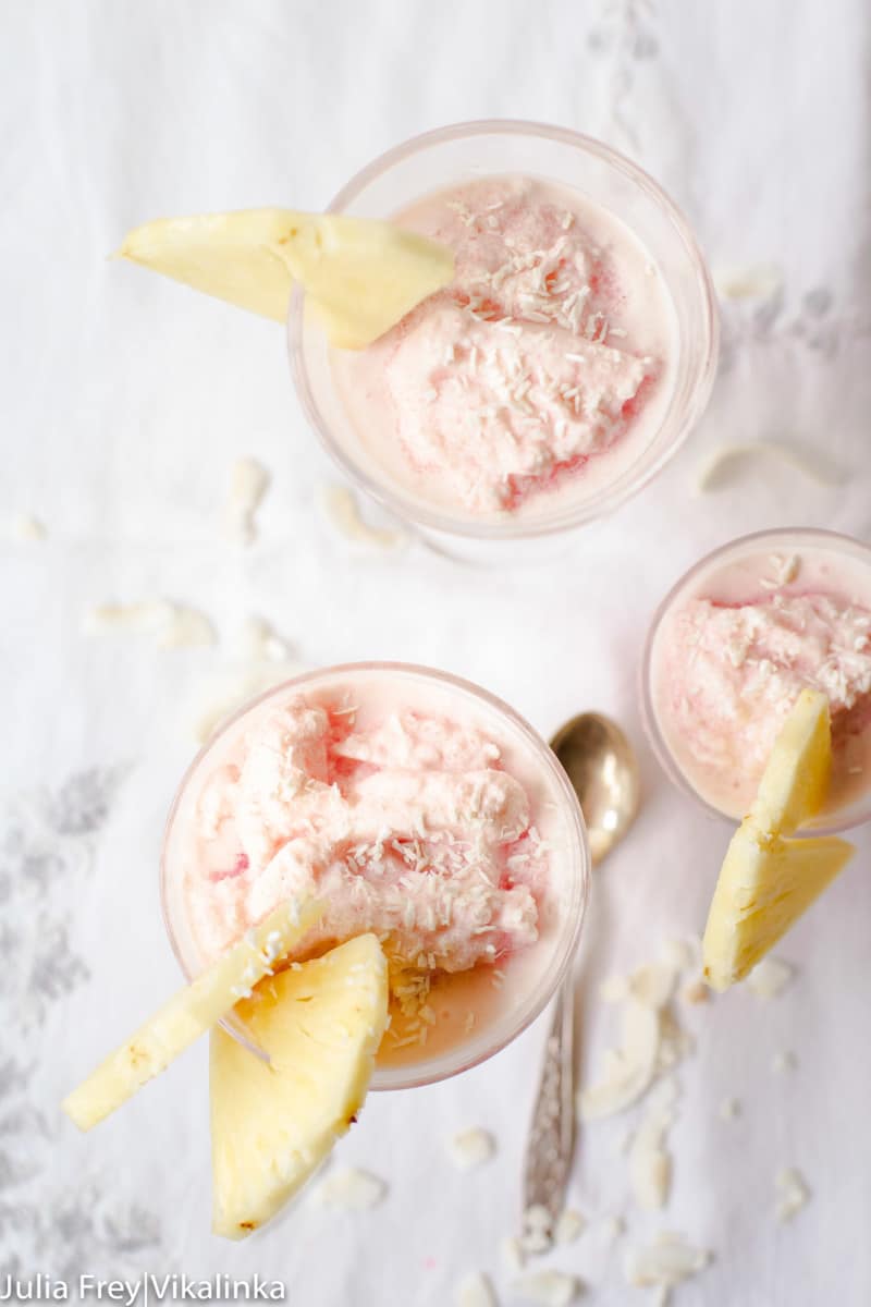 top down view of 3 glasses with frozen blood orange pina colada