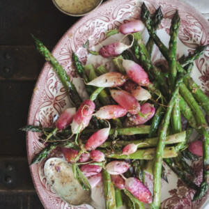 Roasted asparagus and radishes on a platter