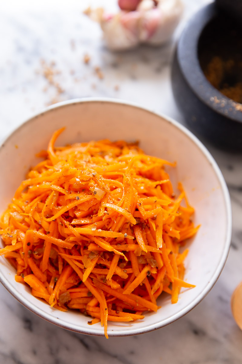 Korean carrot salad in white bowl