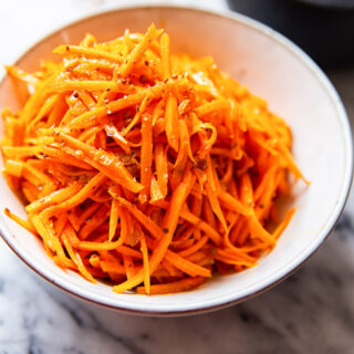 carrot salad in white bowl