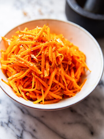 carrot salad in white bowl