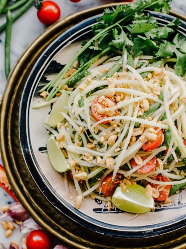 Thai green papaya salad in a bowl from the top down