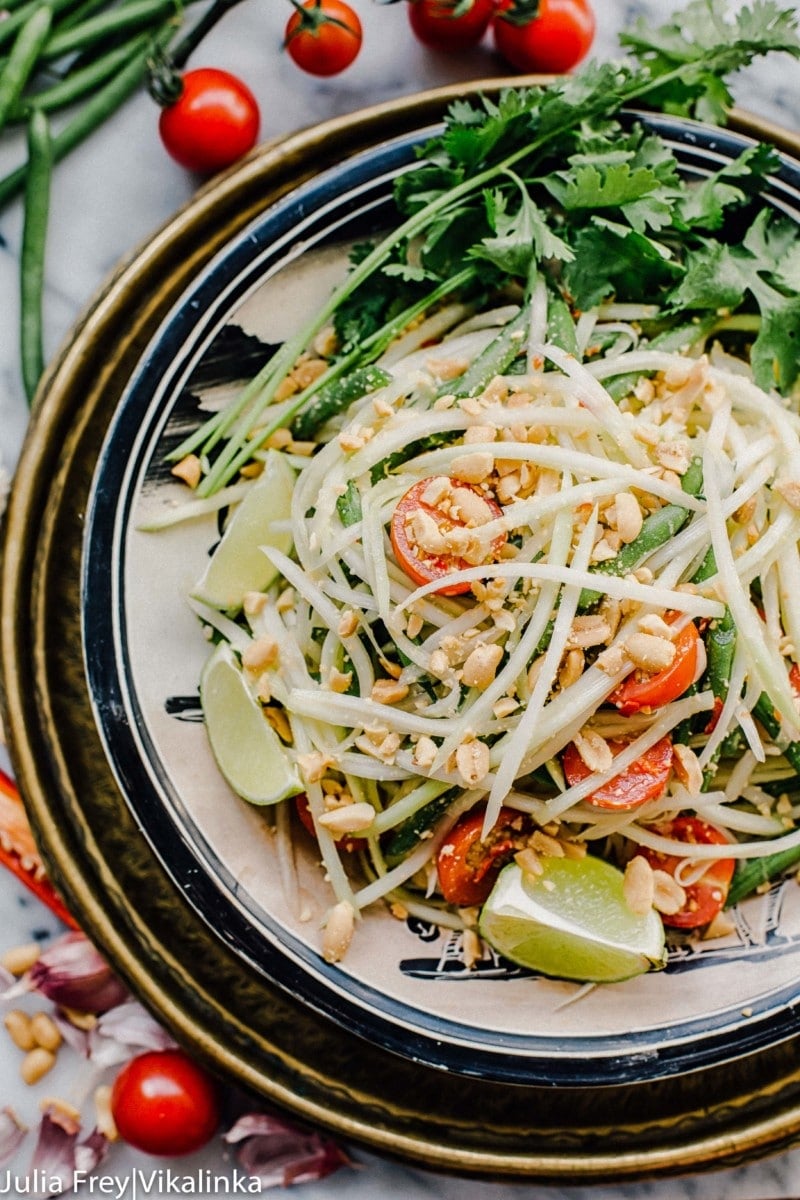 Thai green papaya salad in a bowl from the top down