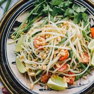 Top down of Thai green papaya salad in a bowl