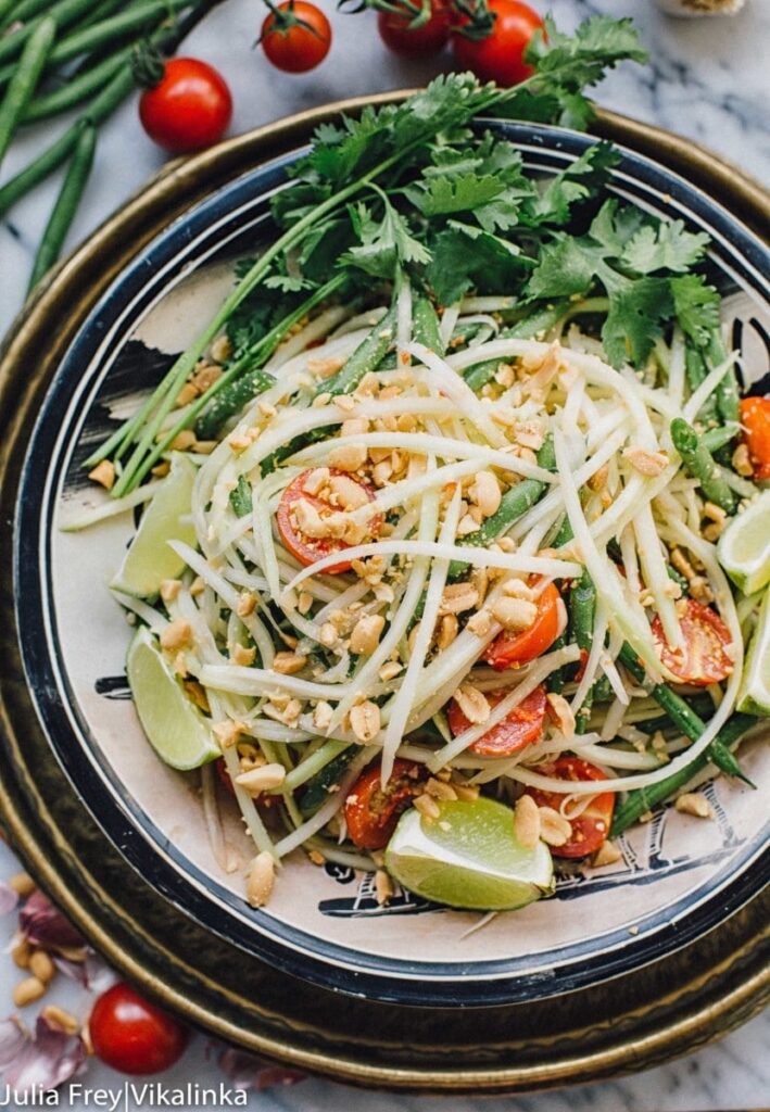 Top down of Thai green papaya salad in a bowl