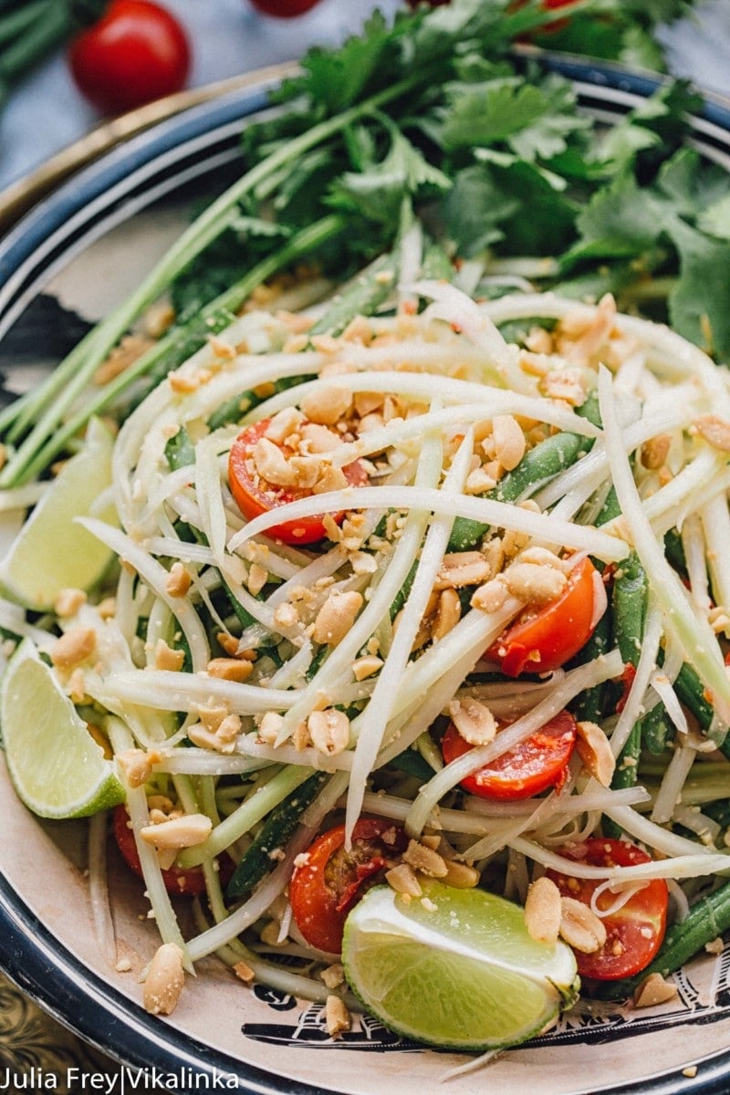 Close up of noodles and tomatoes on greens