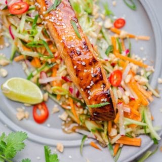 Asian glazed salmon on top of carrot and cucumber slaw with lime and chillies.