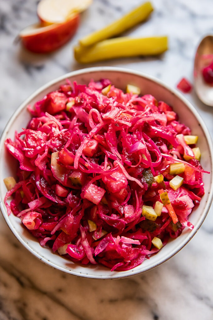 red cabbage and beet salad in a grey bowl