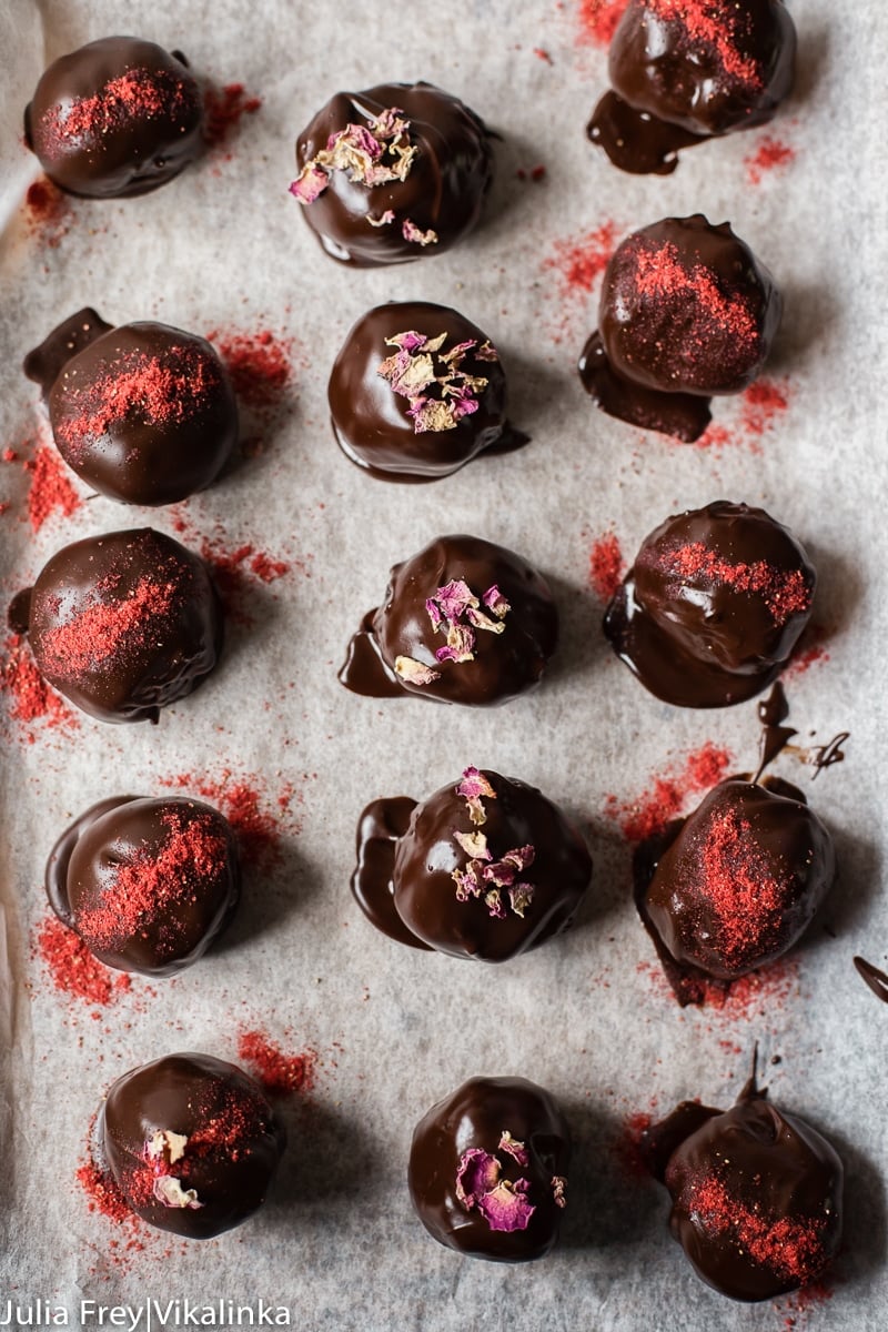 Cake Truffles dipped in chocolate with strawberry dust and rose petals