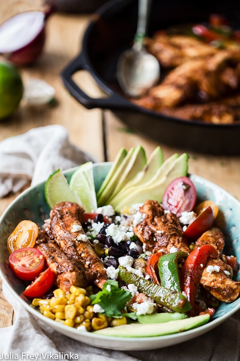 Chicken Fajita Bowl from the side with pan in the background