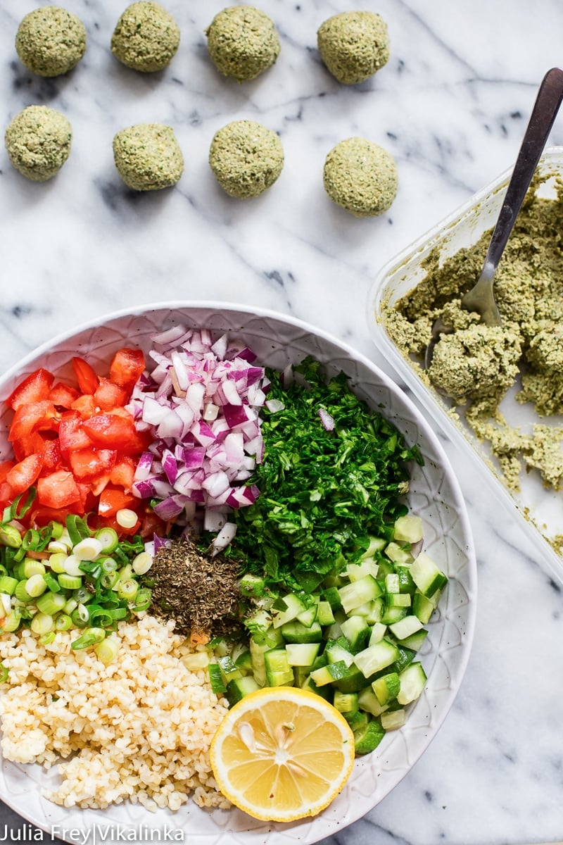 Process shot of falafel salad ingredients