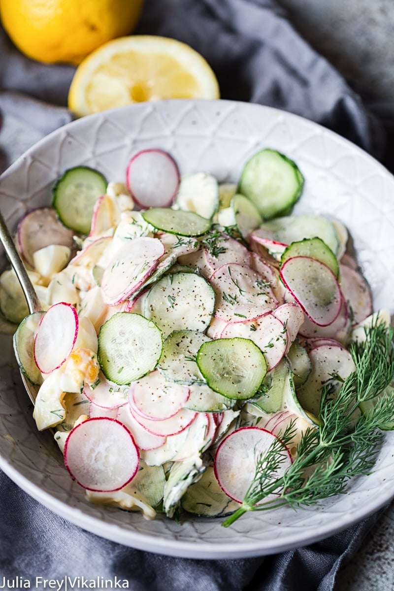 cucumber and radish salad with dill in a grey bowl
