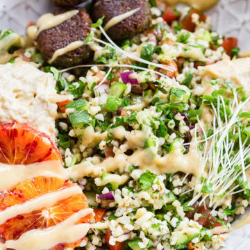 tabbouleh, hummus and falafel in a bowl