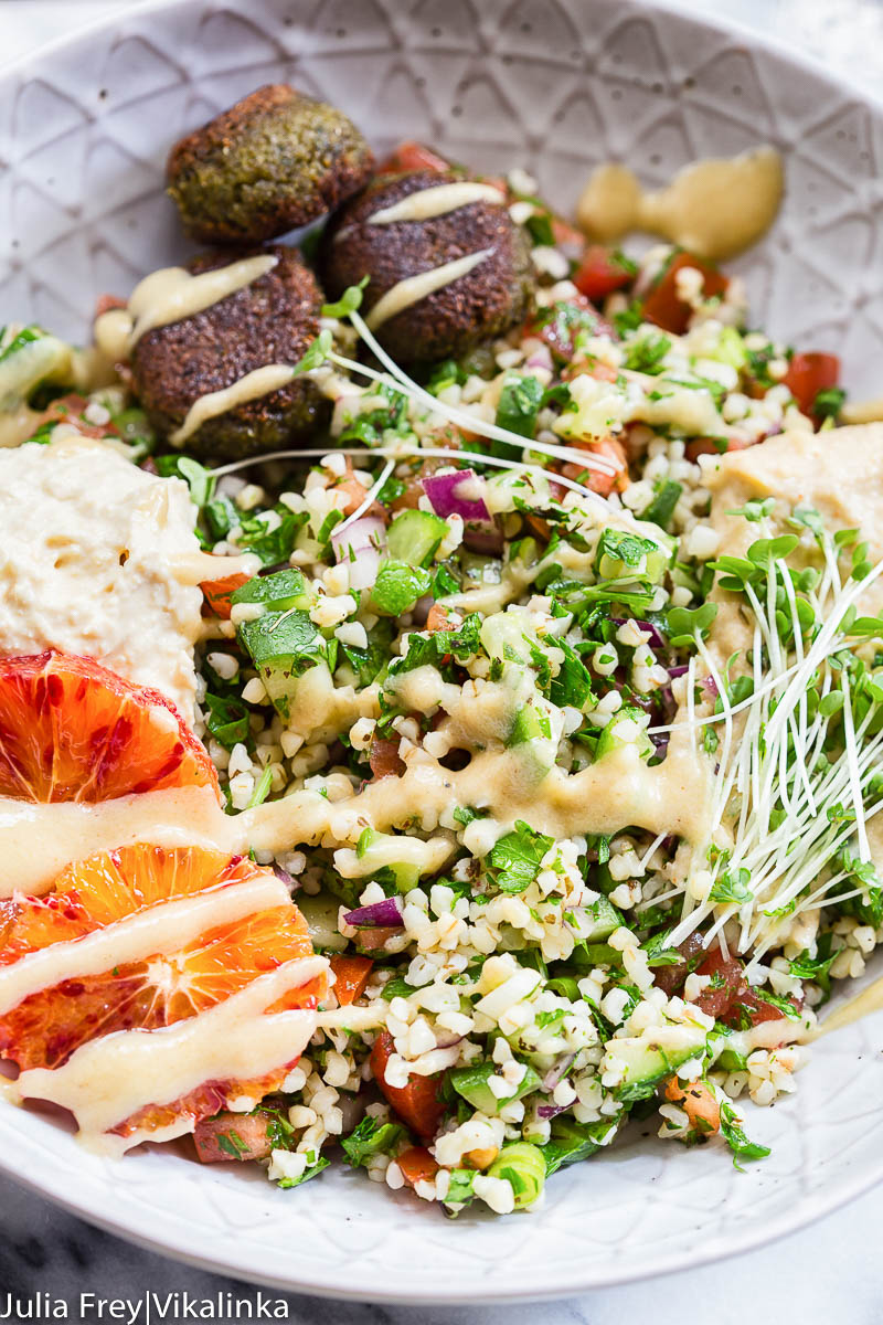 tabbouleh, hummus and falafel in a bowl