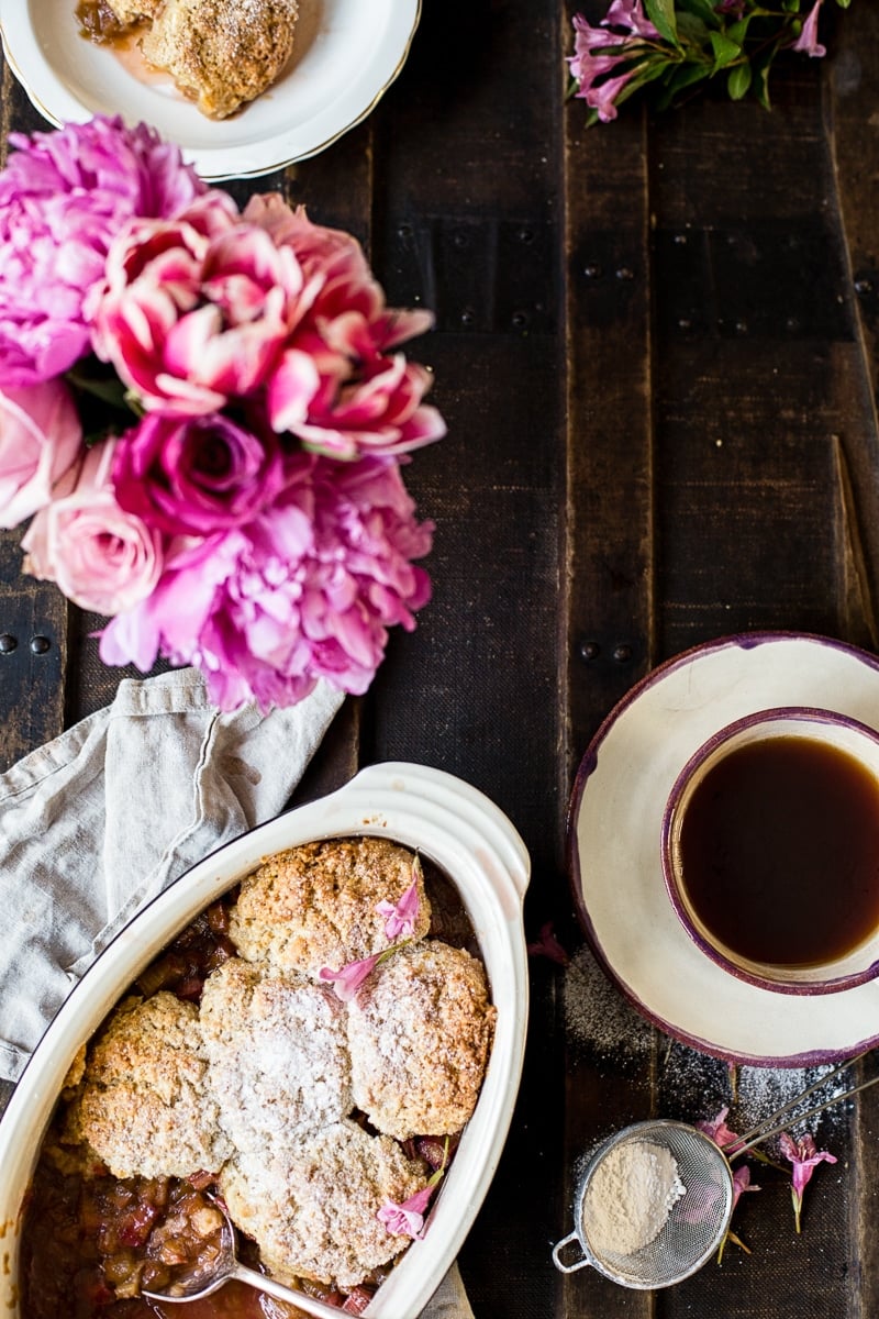 Rhubarb Cobbler from the top down as part of a place setting with tea