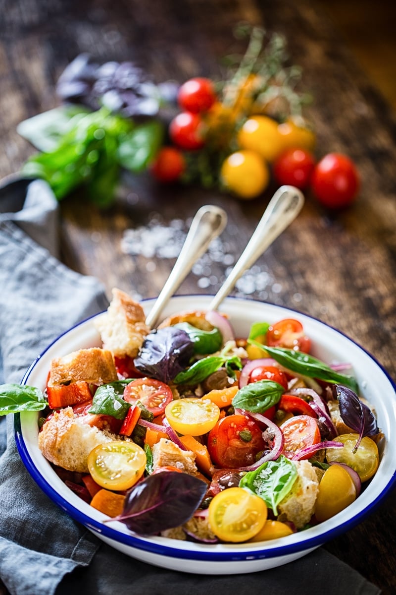 Tuscan Panzanella Salad in white bowl with blue rim