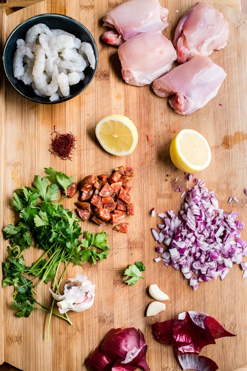 spanish rice ingredients laid out on cutting board.