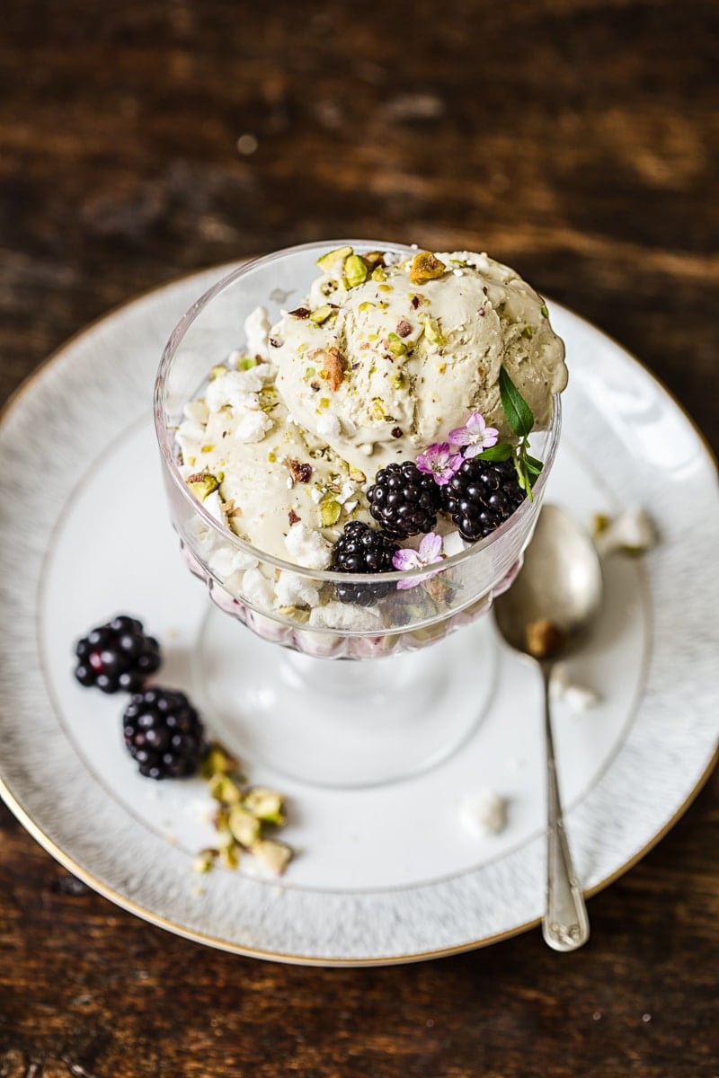 Dish of the Eton mess on a saucer with a spoon