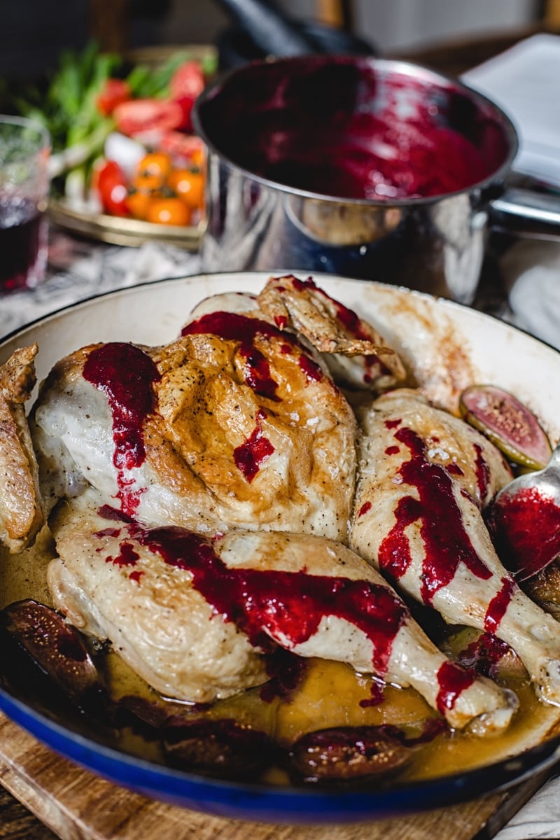 Georgian Chicken Tabaka with Spicy Blackberry Sauce in a dish