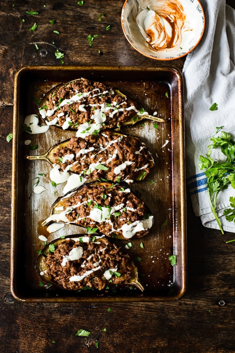 Top down shot of Harissa Beef Stuffed Eggplant on a baking sheet