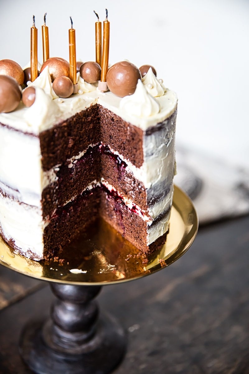 Black and White Chocolate Cake with Blackberry Compote with slice removed