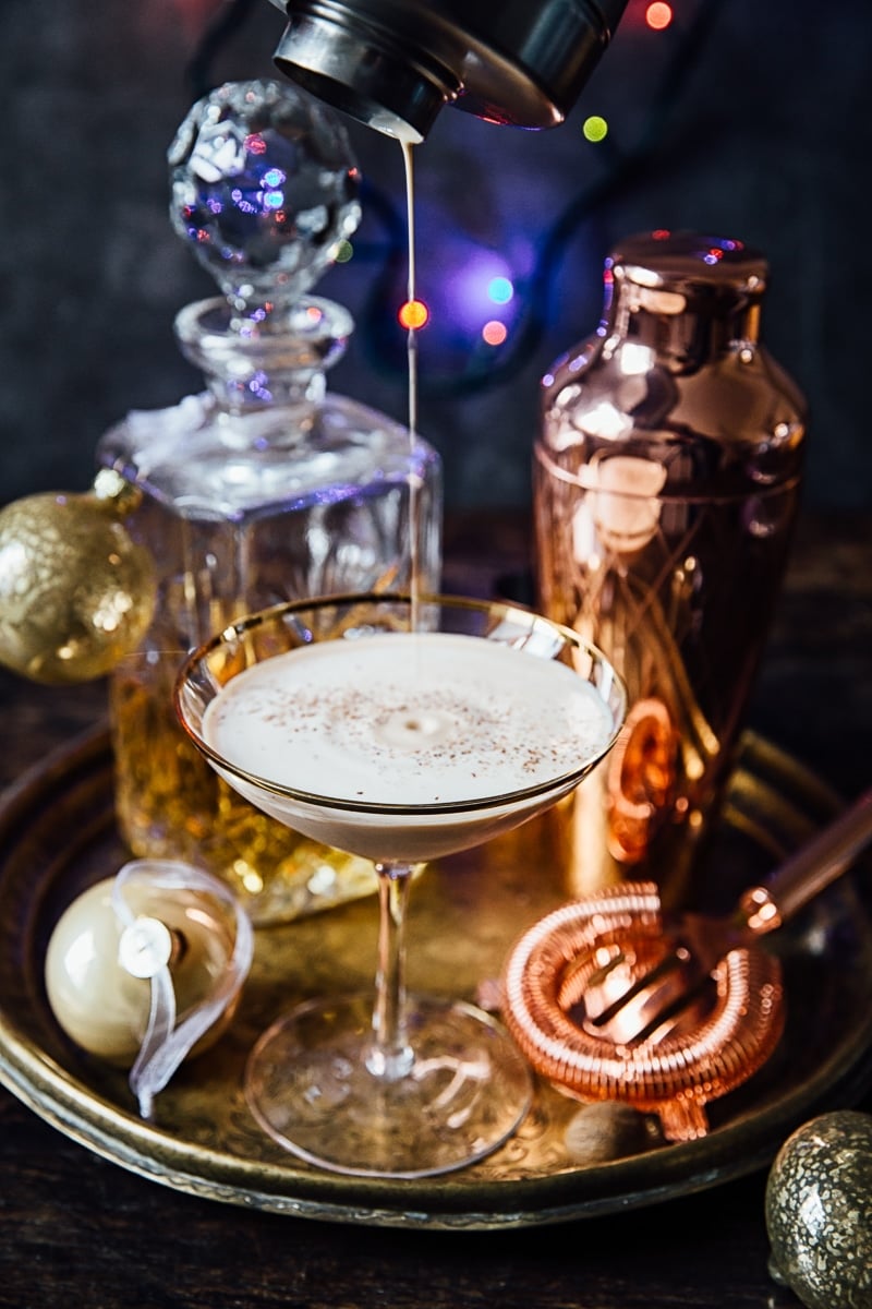 Brandy Alexander Cocktail being poured from a shaker