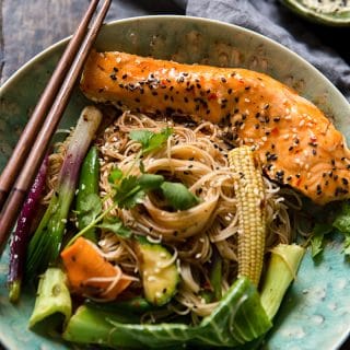 Bowl of fried noodles with vegetables and fish