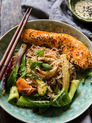 Bowl of fried noodles with vegetables and fish