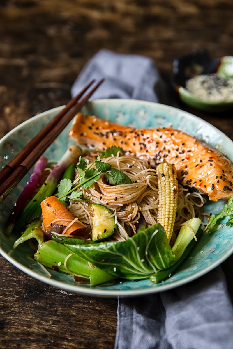 Bowl of chilli lime salmon mee goreng with chopsticks