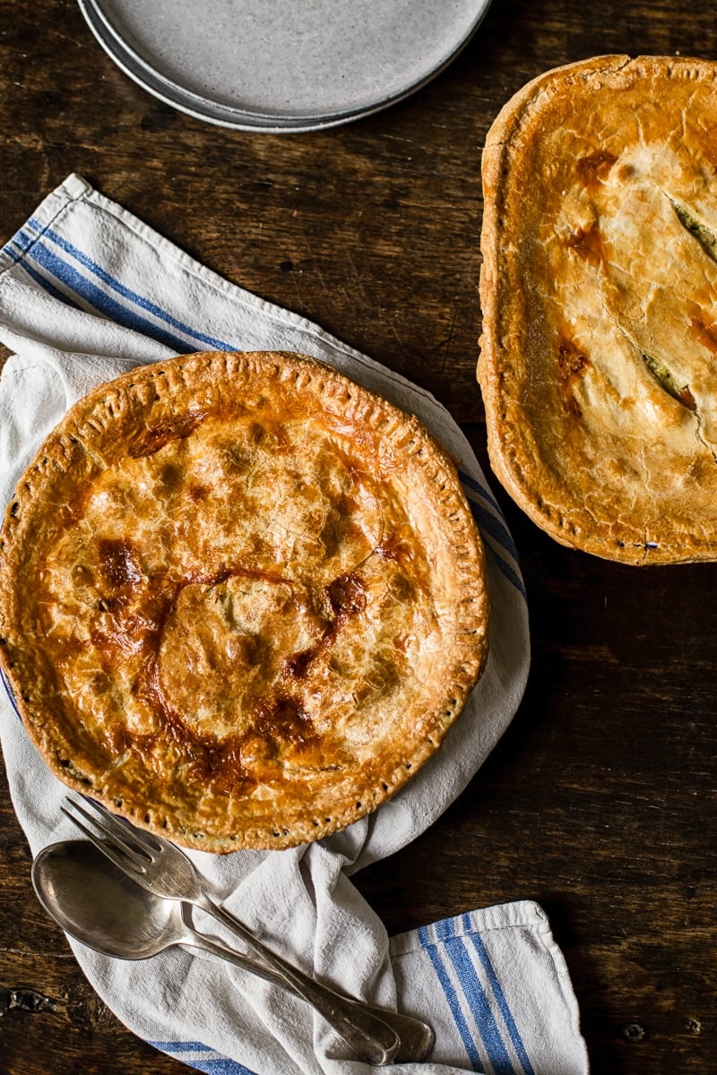 top down view of two pies on a wooden table