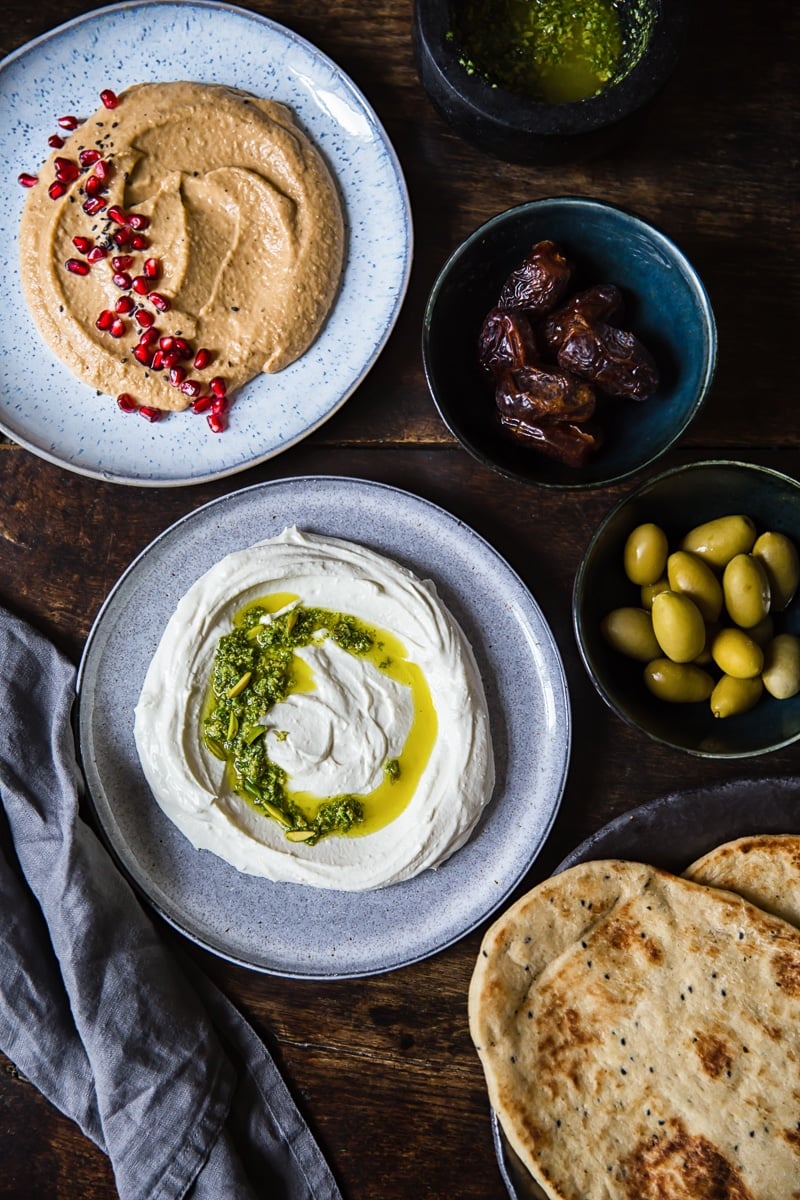 Table spread with dip varieties and flatbread