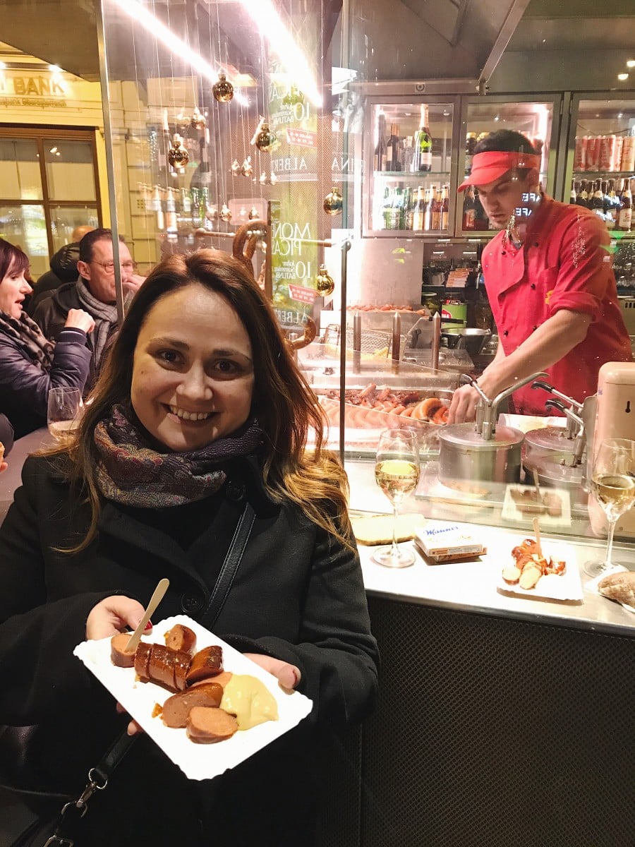 Julia holding sausage at Bitzberger wiener stand