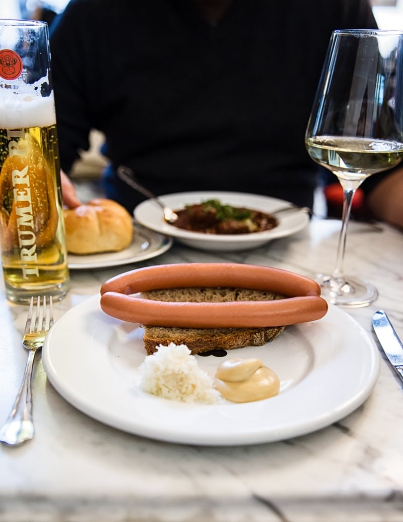 Cafe lunch with sausage, wine and beer