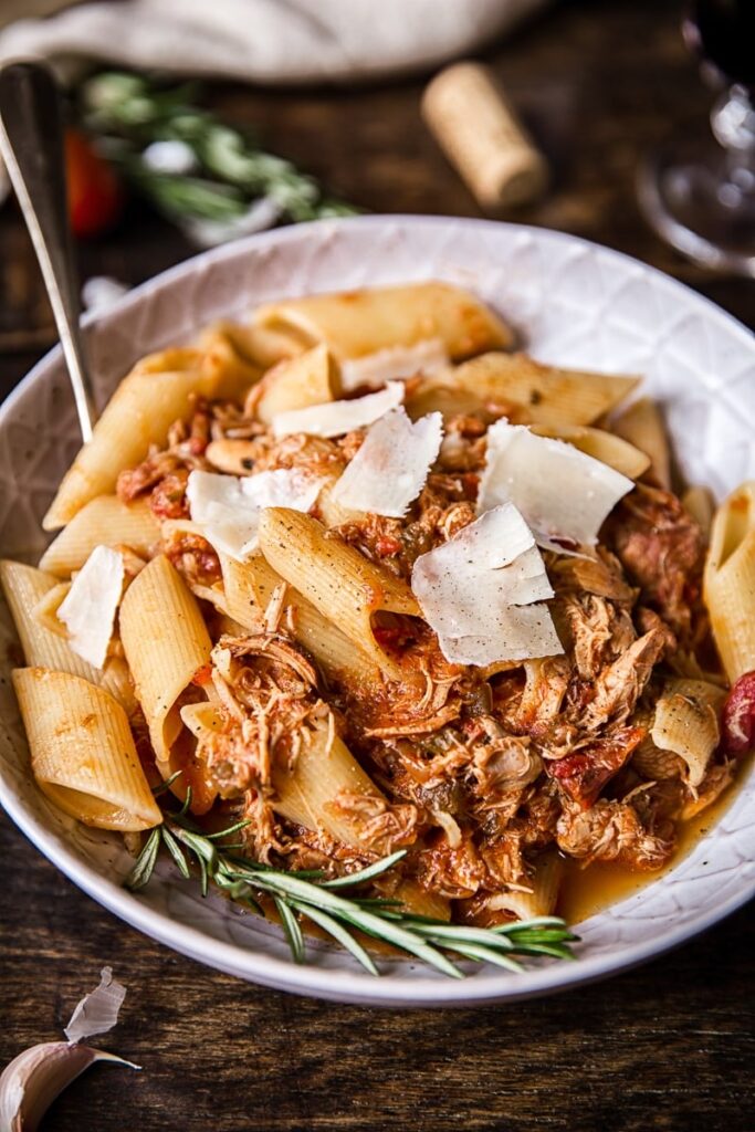 Bowl of the pasta dish with cheese shavings