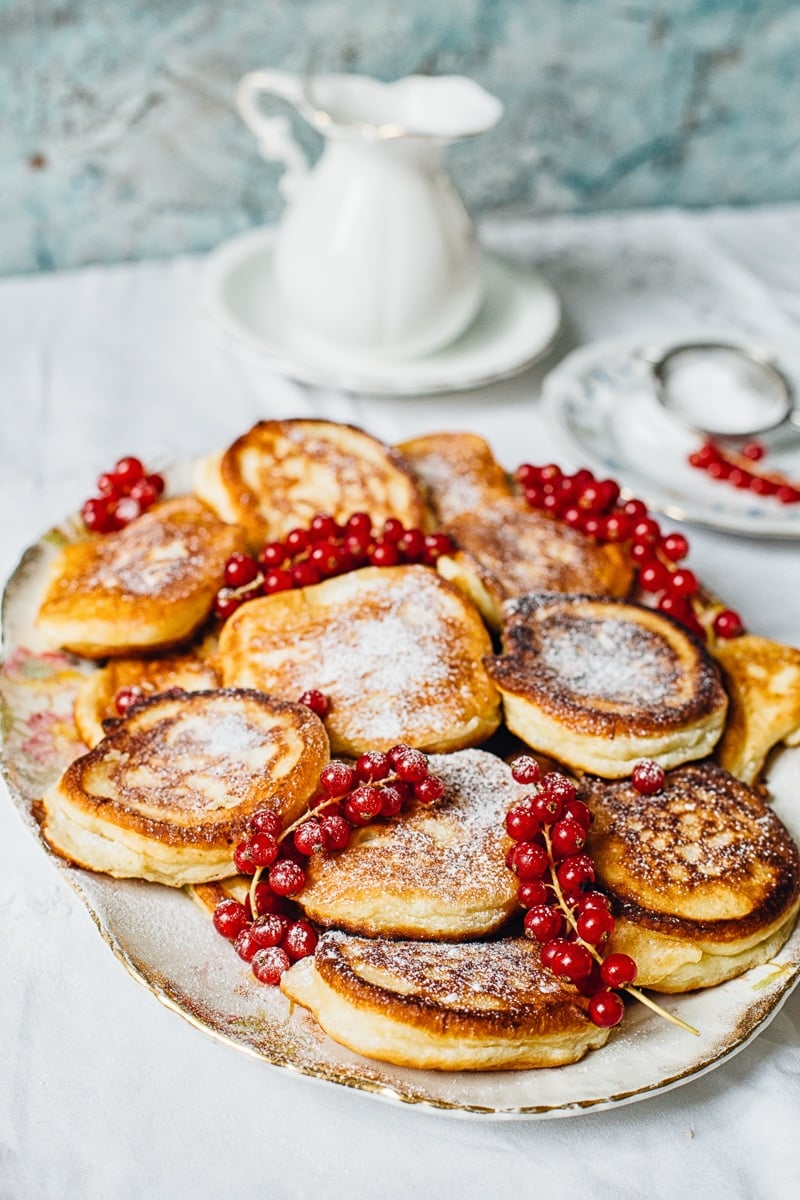 Platter with pancakes dusted with sugar