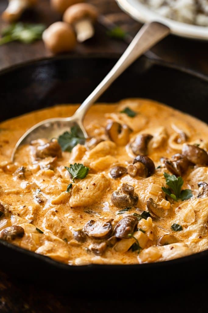 Creamy Chicken Stroganoff with Mushrooms in a cast iron pan