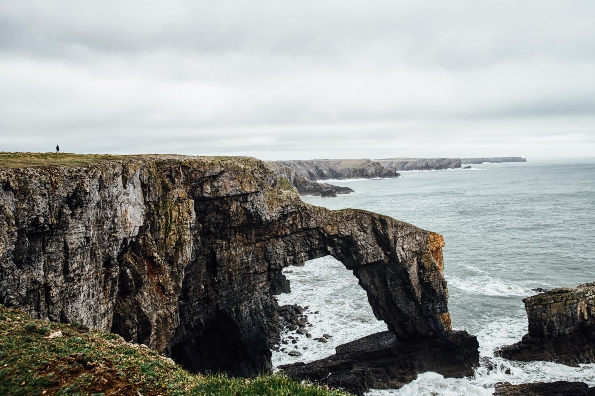 The Green Bridge of Wales over stormy sea