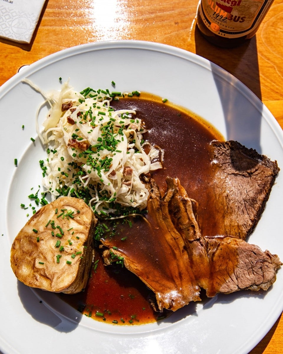 Meat, dumpling and sauerkraut on a plate