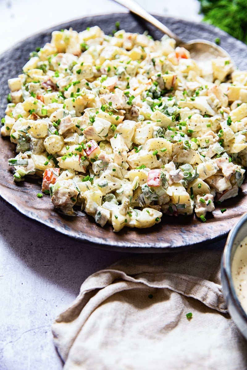 side view of potato salad on brown platter