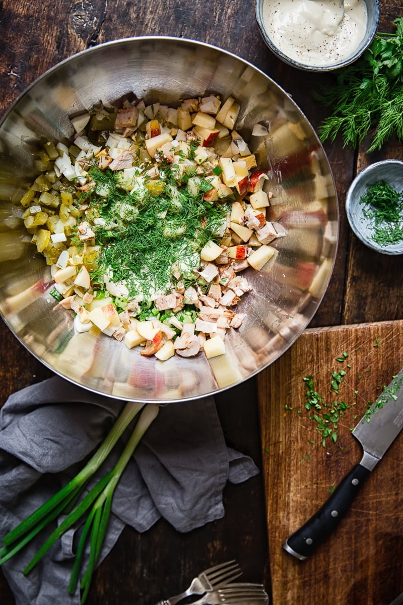 undressed potato salad in a stainless steel bowl 