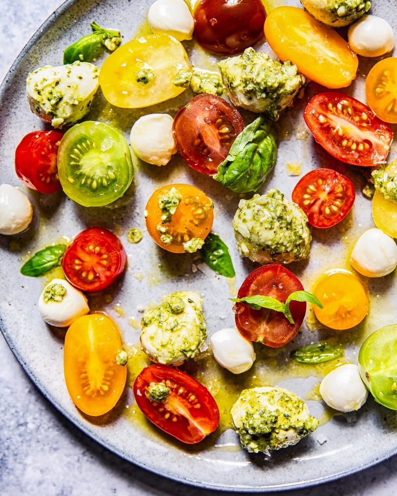 Close up of Basil Pesto Caprese Salad on a grey plate