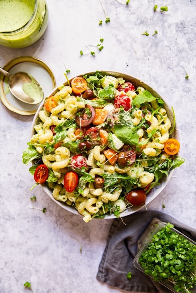 Salad in a bowl with pasta and greens