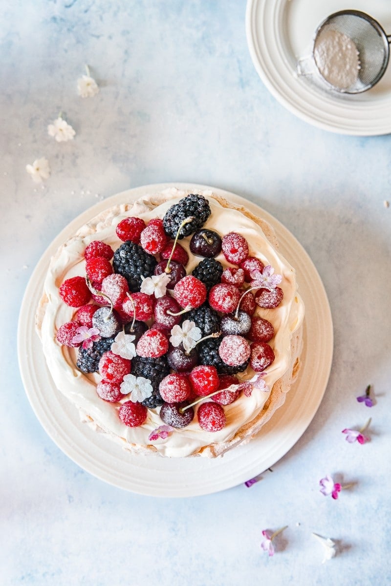 Top down view of pavlova with berries on top