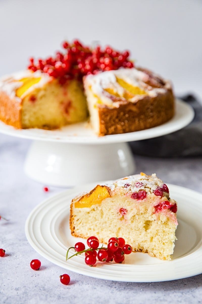 slice of cake in foreground with cake behind