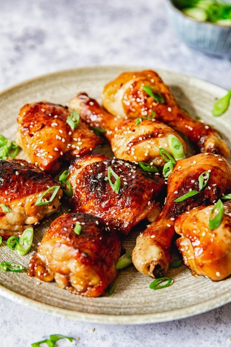 side view of chicken thighs and legs on a platter 