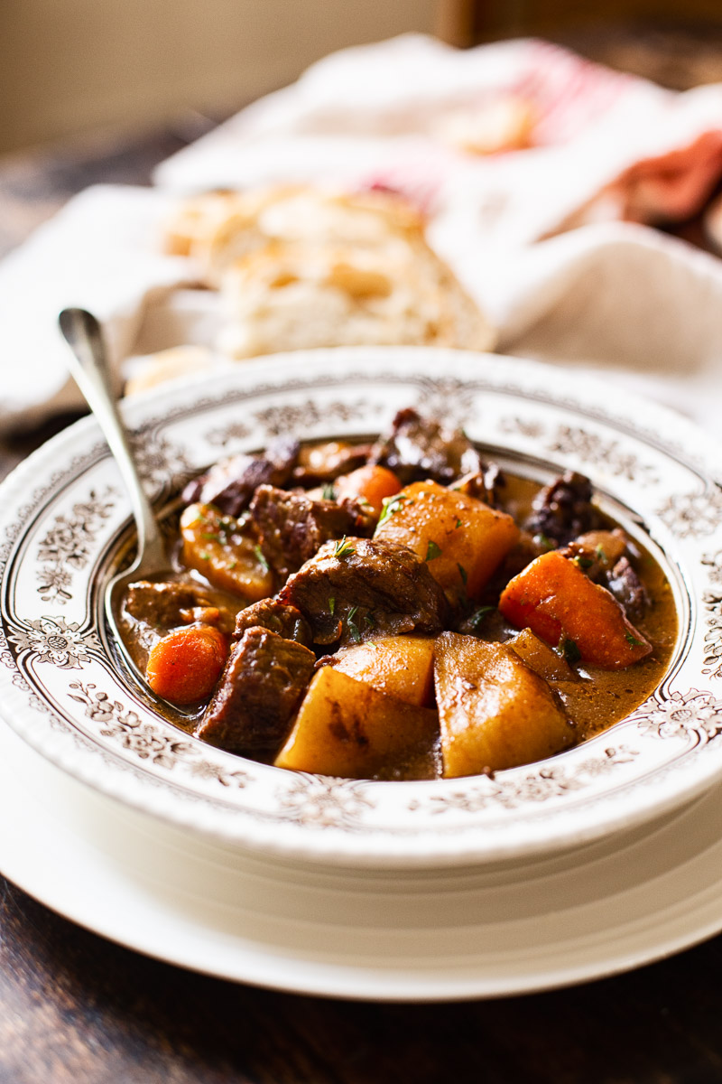 Bowl with meat and potatoes in a bowl with spoon