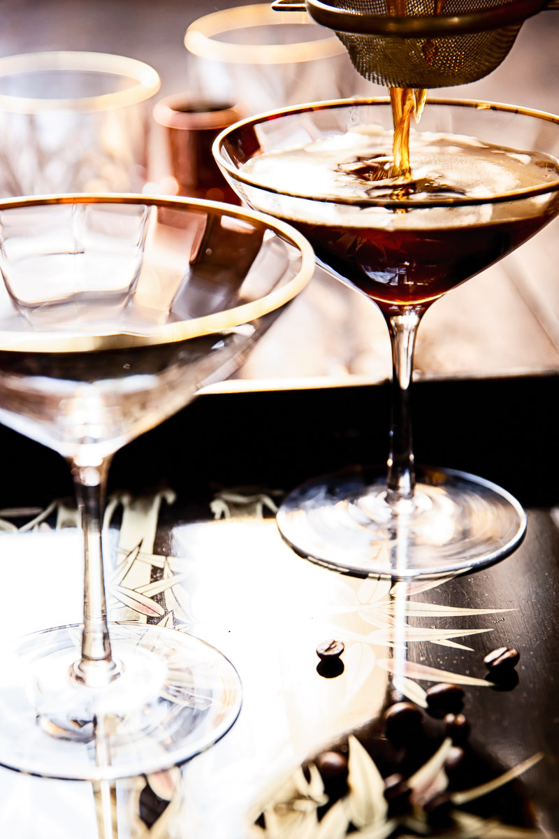 Espresso Martinis being poured through strainer