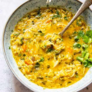 Mulligatawny Soup in a bowl with a spooon