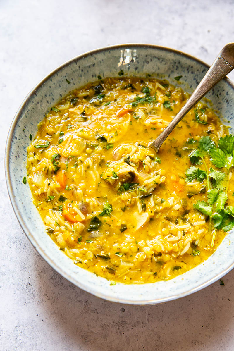 Mulligatawny Soup in a bowl with a spooon