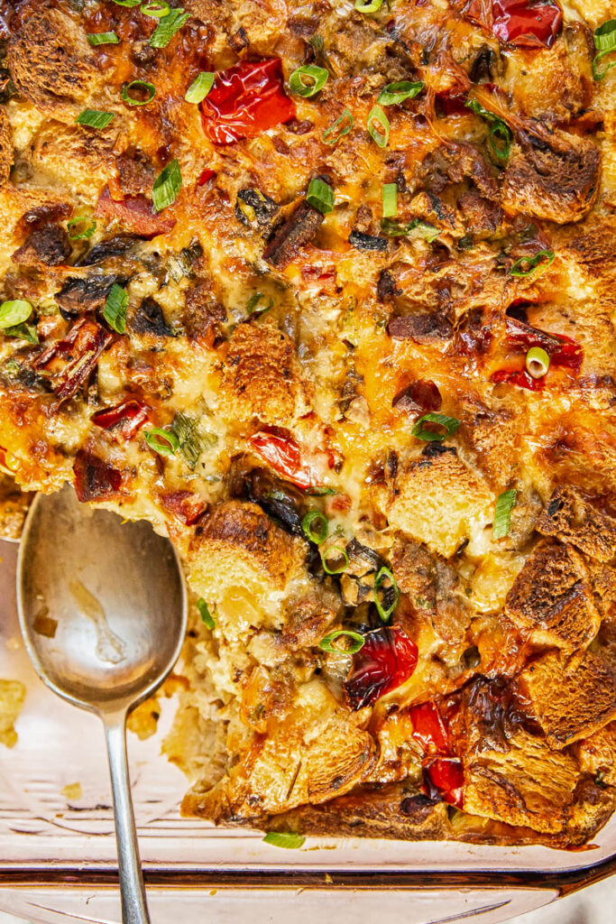 Top down of the overnight breakfast casserole with a spoon